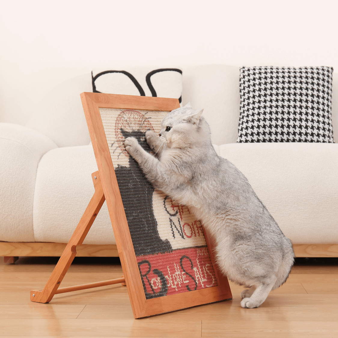 Cat enjoying the ultimate sisal art frame scratcher in a cozy living room setting.