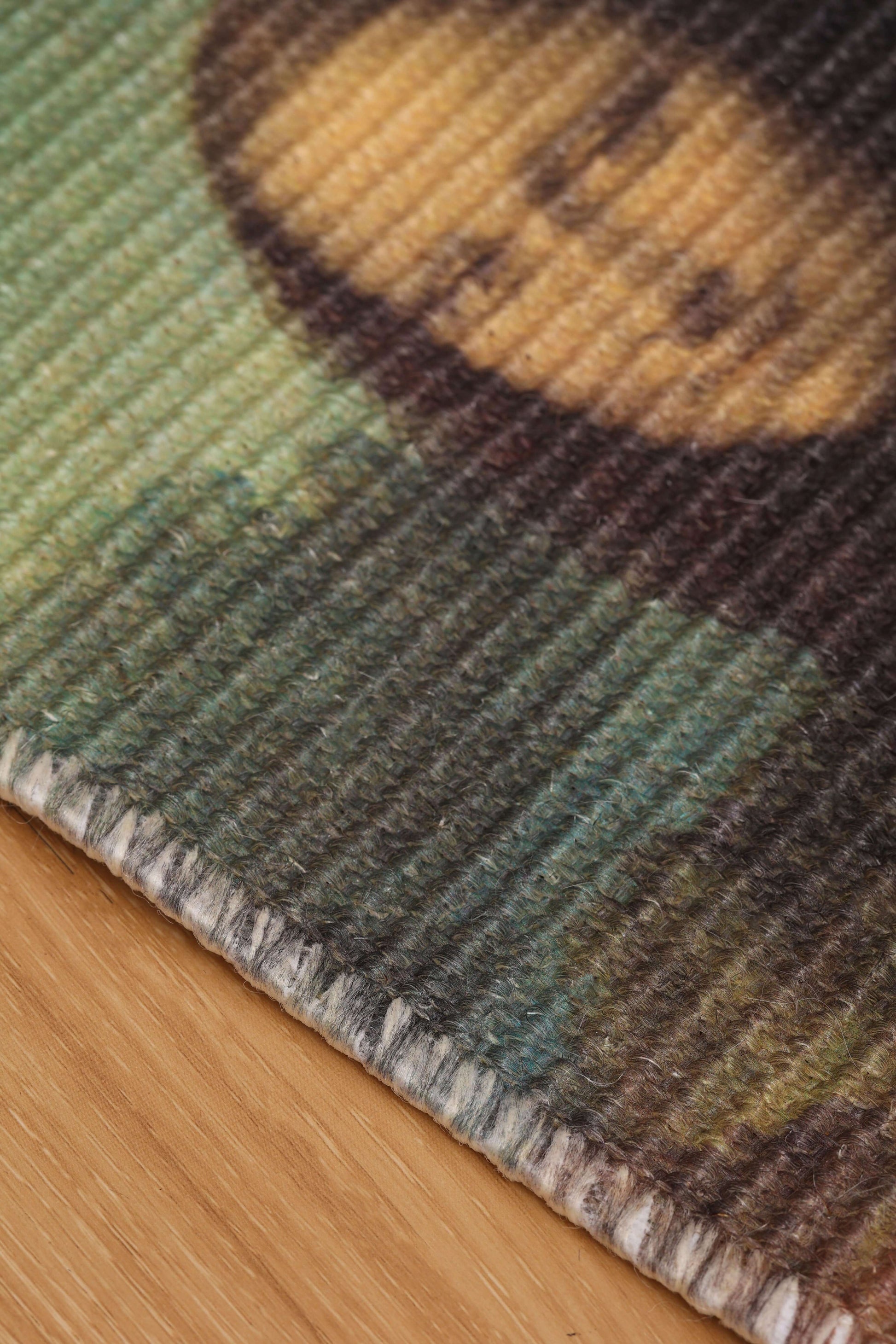 Close-up of art-inspired natural sisal scratching mat featuring textured surface for cats to scratch.