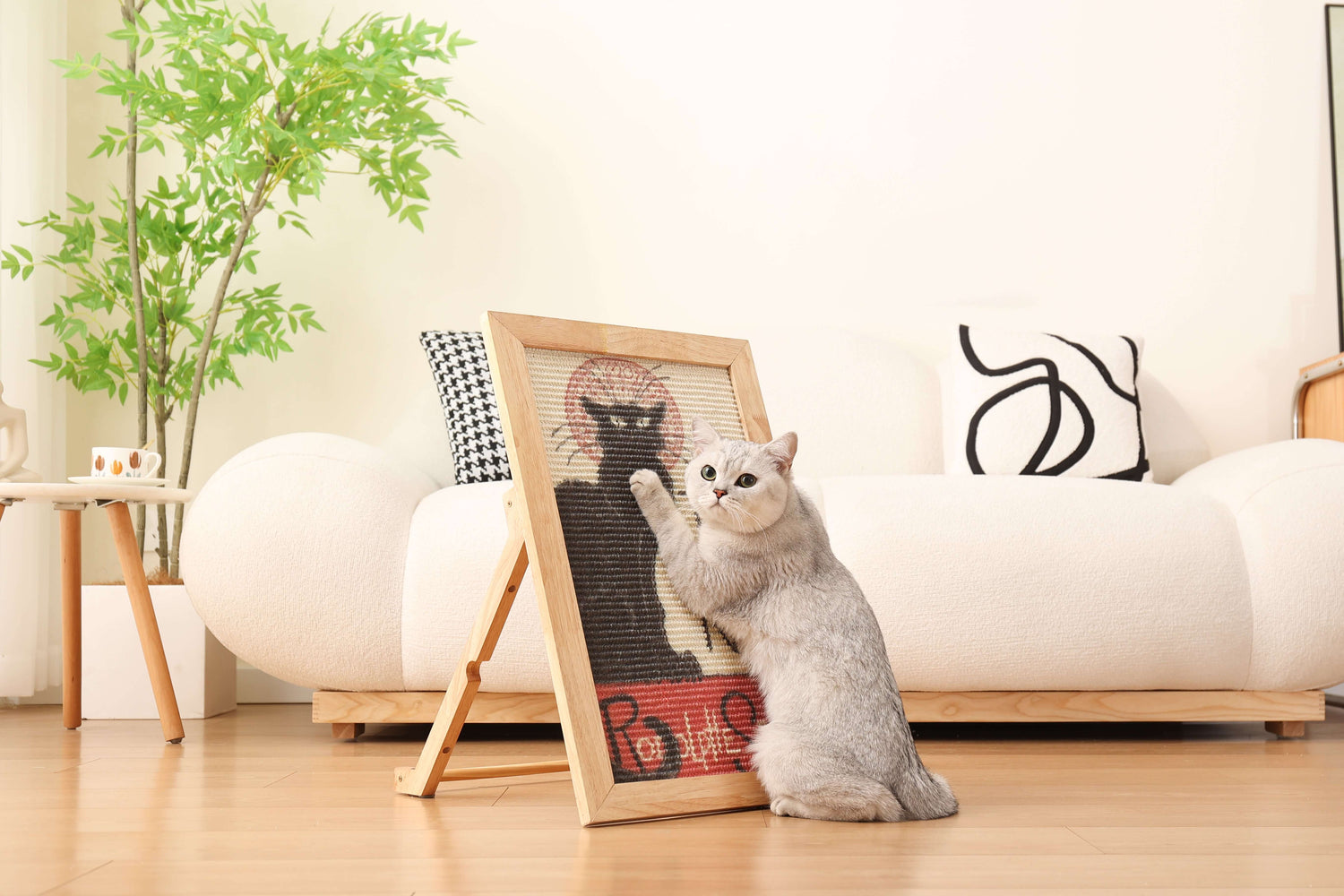 Cat enjoying the Ultimate Art Scratcher in a stylish living room, designed for play and relaxation.