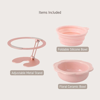 Adjustable metal pet bowl stand with foldable silicone bowl and floral ceramic bowl included.