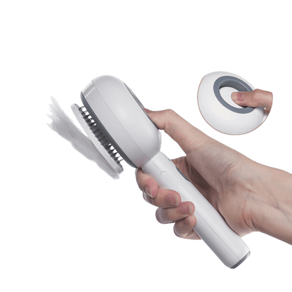 Hand holding a Steam Cat Brush showing one-click hair removal feature with a modern design for easy cat grooming.