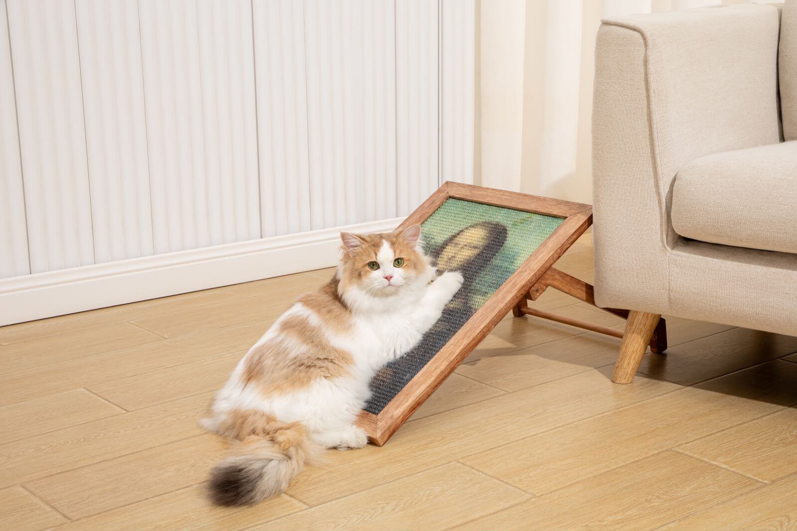 A fluffy cat enjoying the Ultimate Art Scratcher, a stylish sisal art frame scratcher for fun and relaxation.